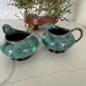 Cream and Saucer by Evangeline Canada